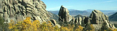 Morning Glory Spire surrounded by brillant fall colors